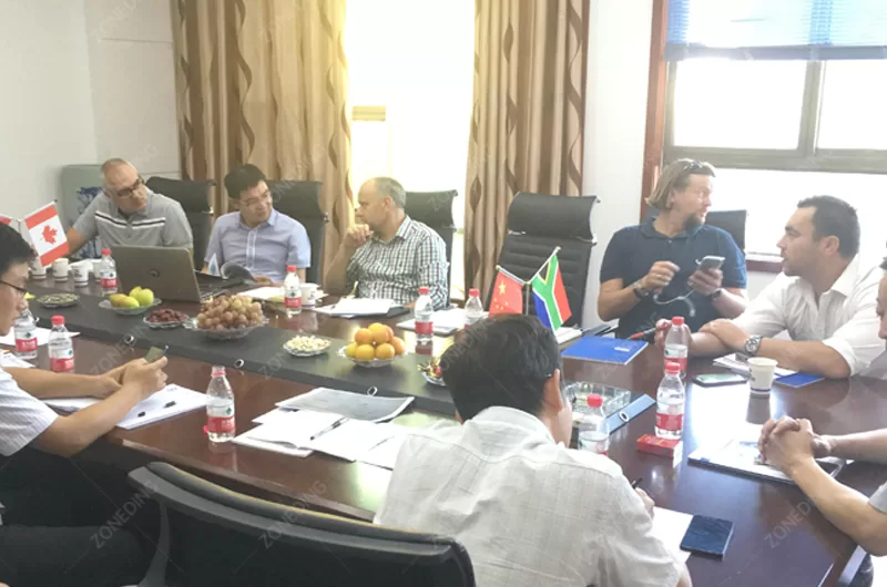 Engineers discussing flotation plant design with supplier representatives